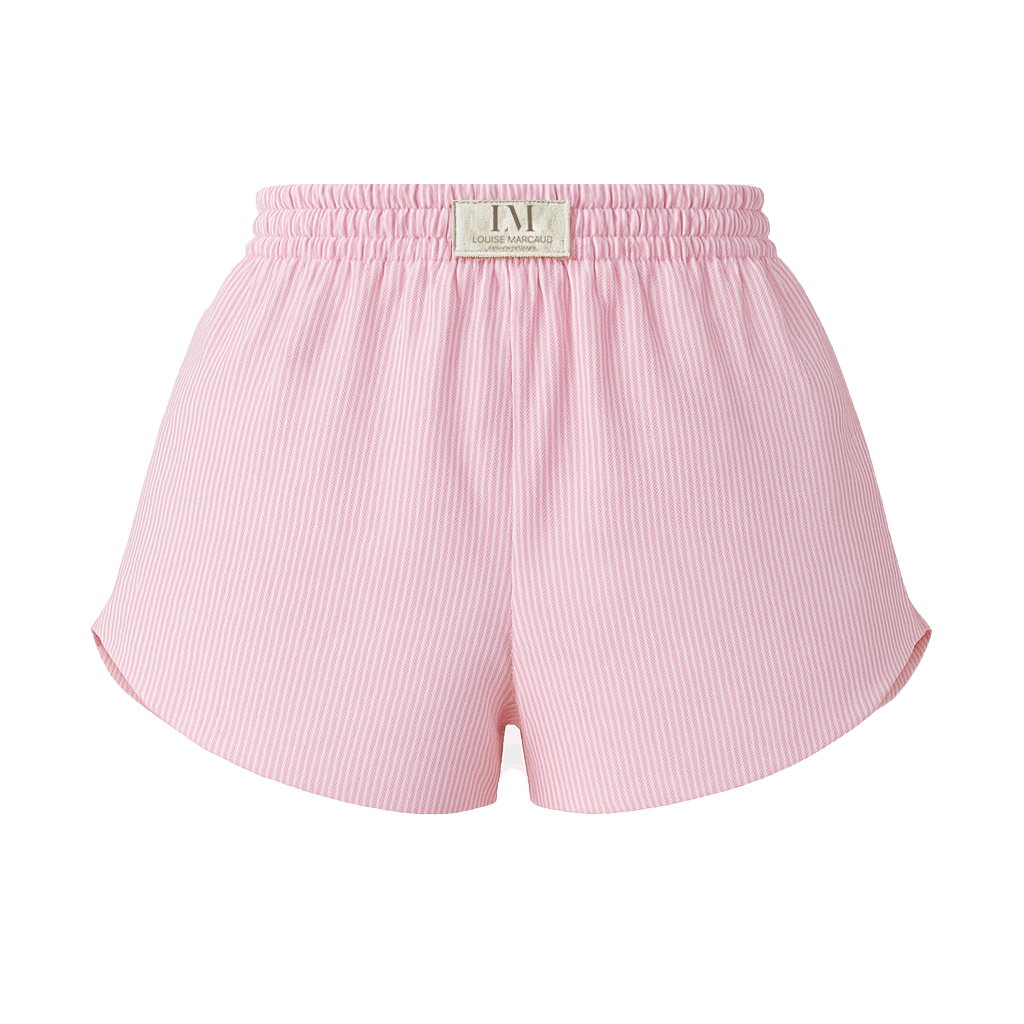 Détail du SHORT BLOOM rose : élastique à la taille et griffe de marque, style sportif chic.