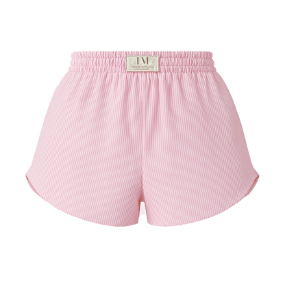 Détail du SHORT BLOOM rose : élastique à la taille et griffe de marque, style sportif chic.